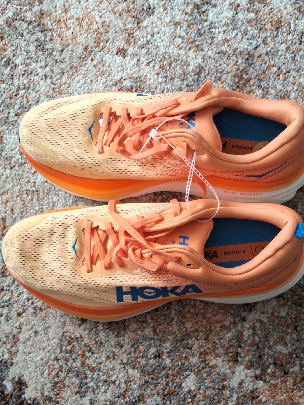 Hoka Peach and Bright Orange Bondi 8 Running Shoes